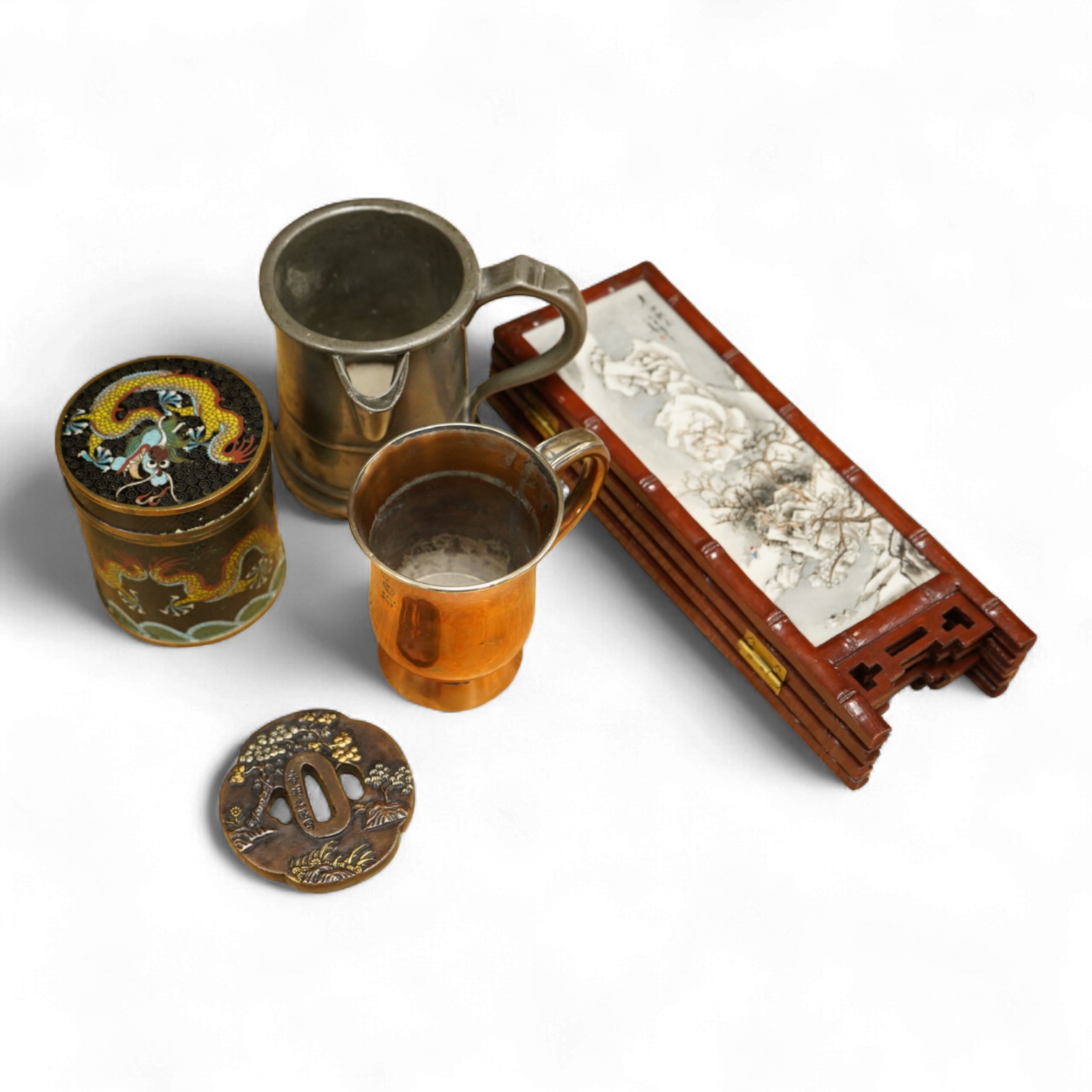 A Chinese cloisonné enamel ‘dragon’ jar and cover, a Chinese miniature four-fold table screen, two metalware tankards and a reproduction Japanese tsuba, cloisonne jar 9cm